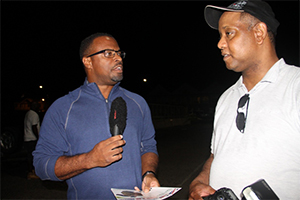 Deputy Premier of Nevis and Minister of Culture and Tourism Hon. Mark Brantley (r) and Chris Collins of JC Tours at the Charlestown Pier on July 29, 2014